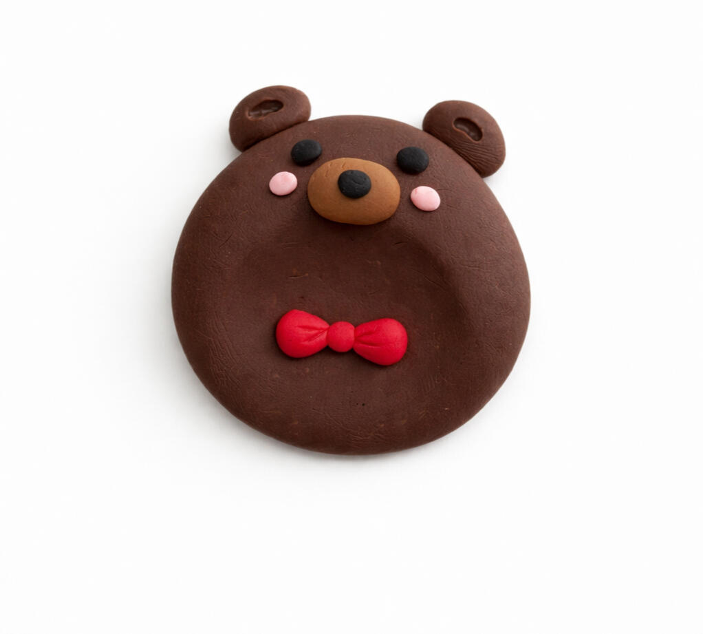 cute brown teddy bear worry stone with bow tie