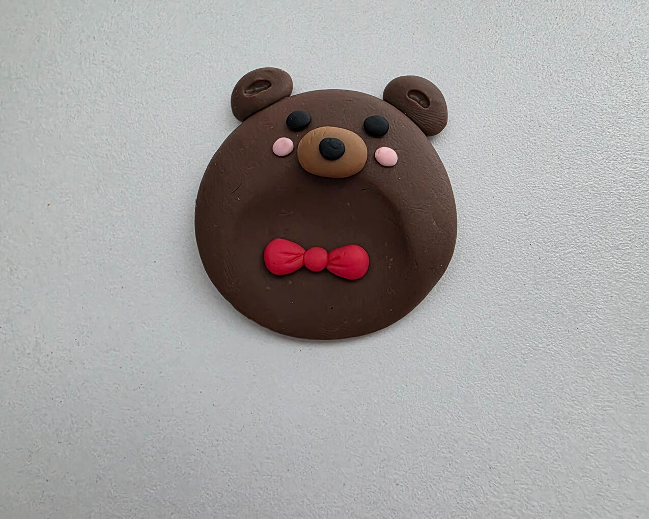 cute brown teddy bear worry stone with bow tie