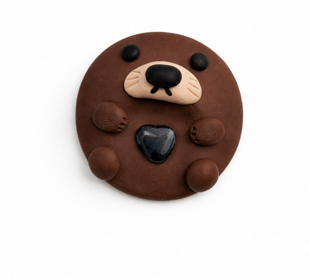 otter worry stone with favorite rock