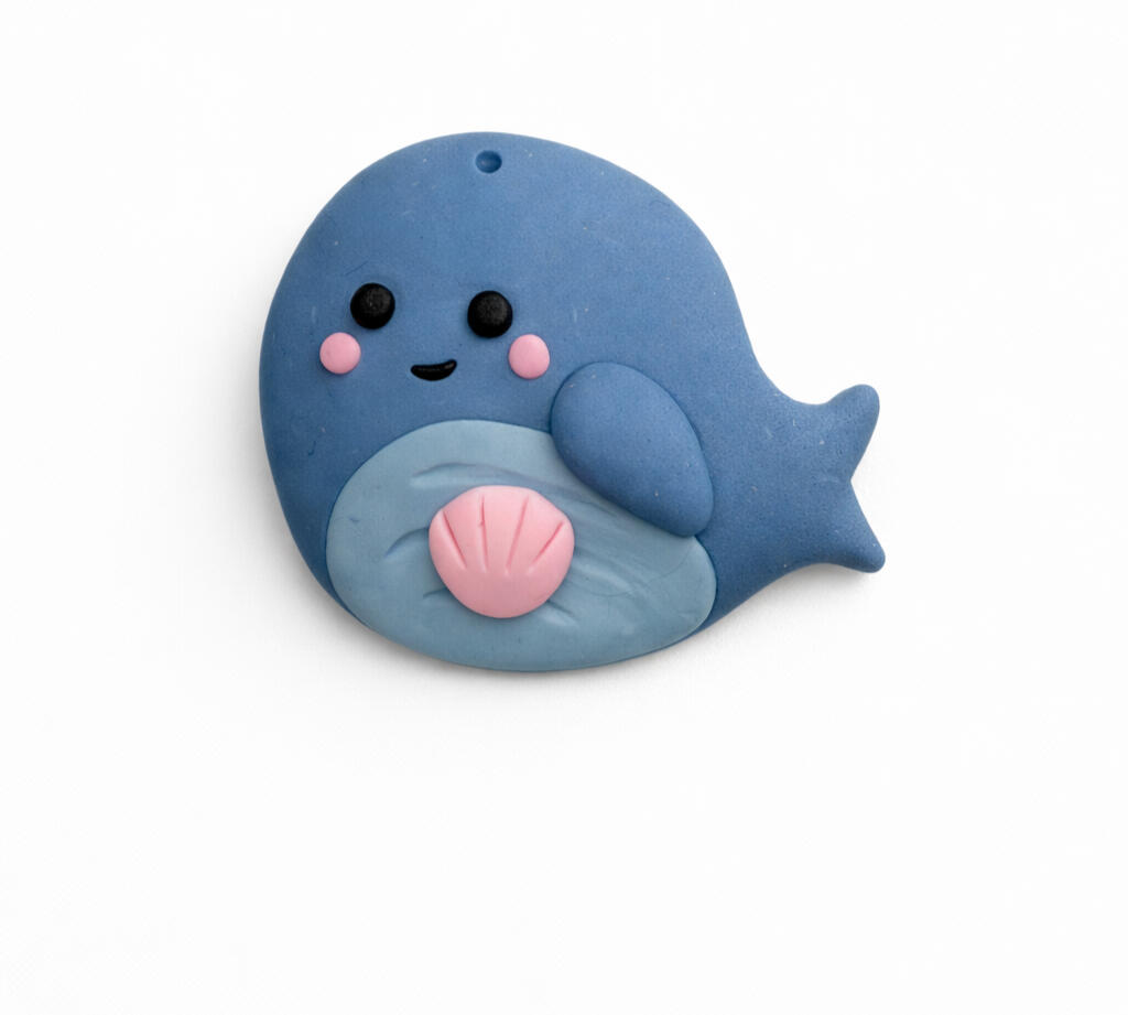 whale worry stone with pink clam shell