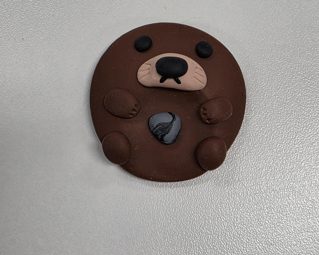 otter worry stone with favorite rock