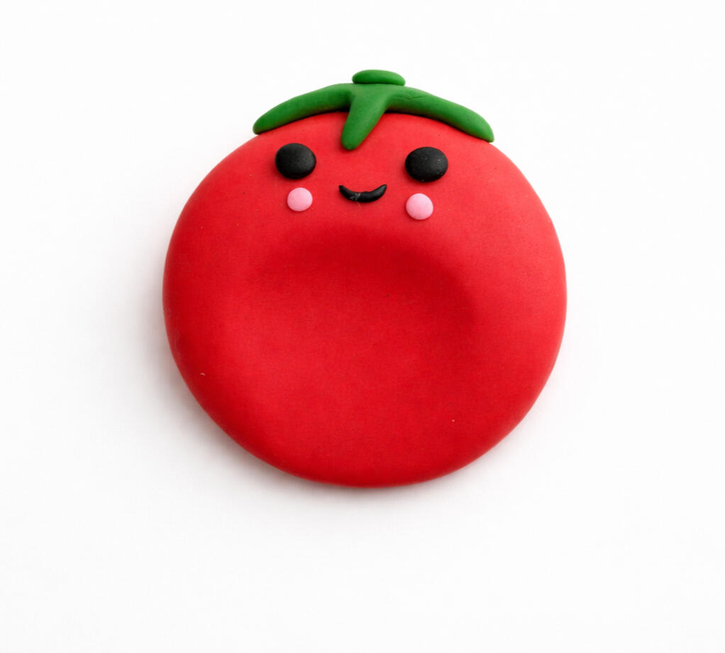 smiling red tomato worry stone